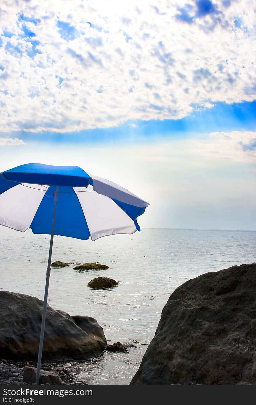 Marine beach with sun umbrella