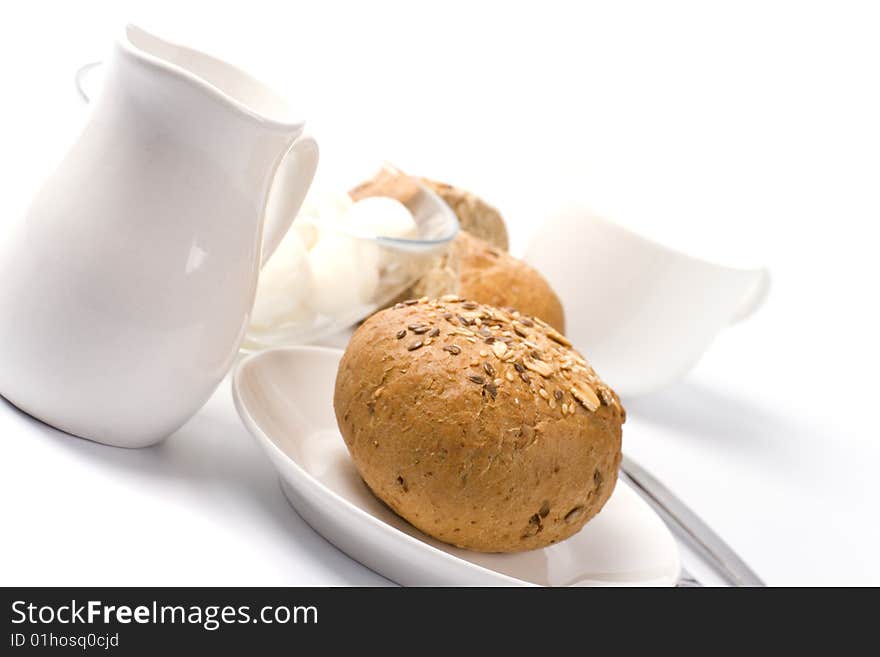 Bread, milk and mozzarella closeup on white