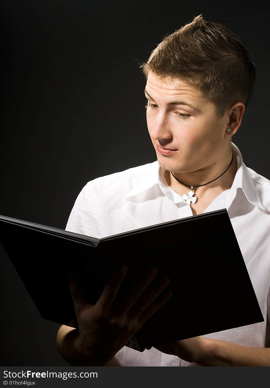 A man reading a documents in surprise