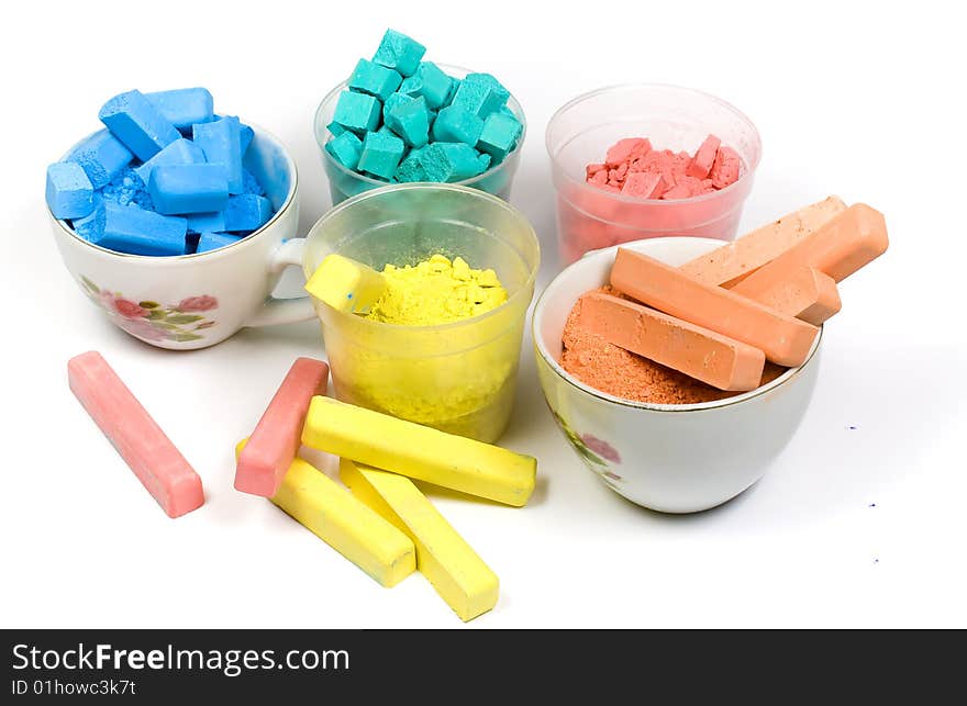 Several colors crushed chalk in tubes and caps