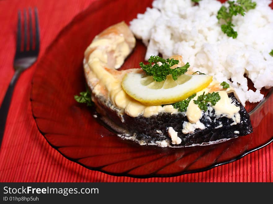 Plate with slice of salmon and rice. Plate with slice of salmon and rice