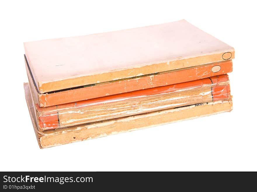 Old paperback books isolated against a white background