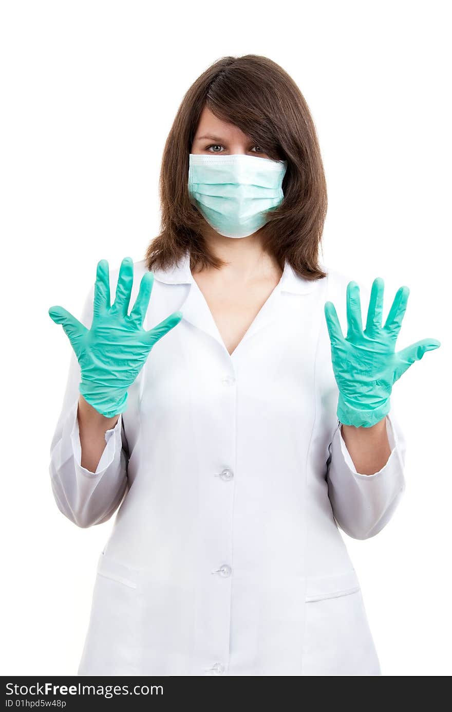 Young doctor prepares for surgery over white background