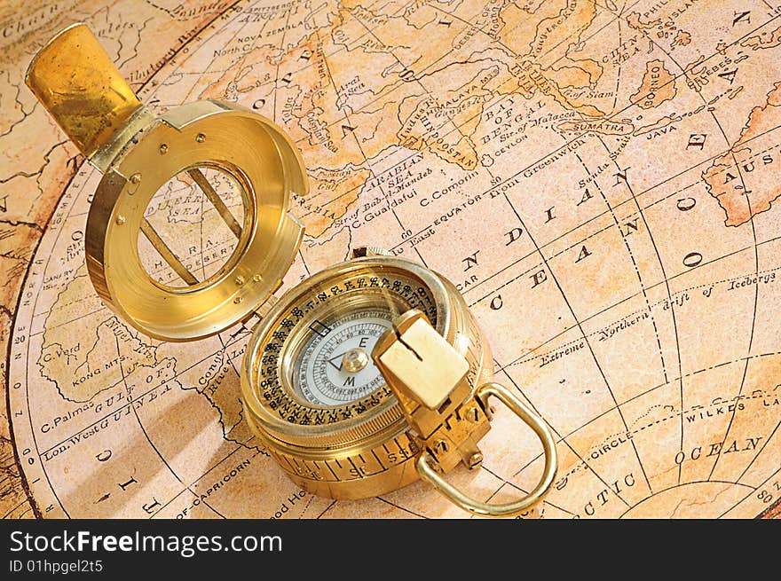 Old-fashioned compass on a background