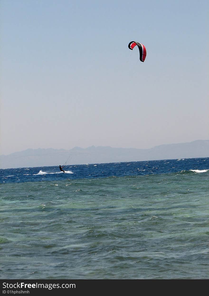 A kiteboarder on the Red Sea on the Sinai Peninsula in Egypt. A kiteboarder on the Red Sea on the Sinai Peninsula in Egypt