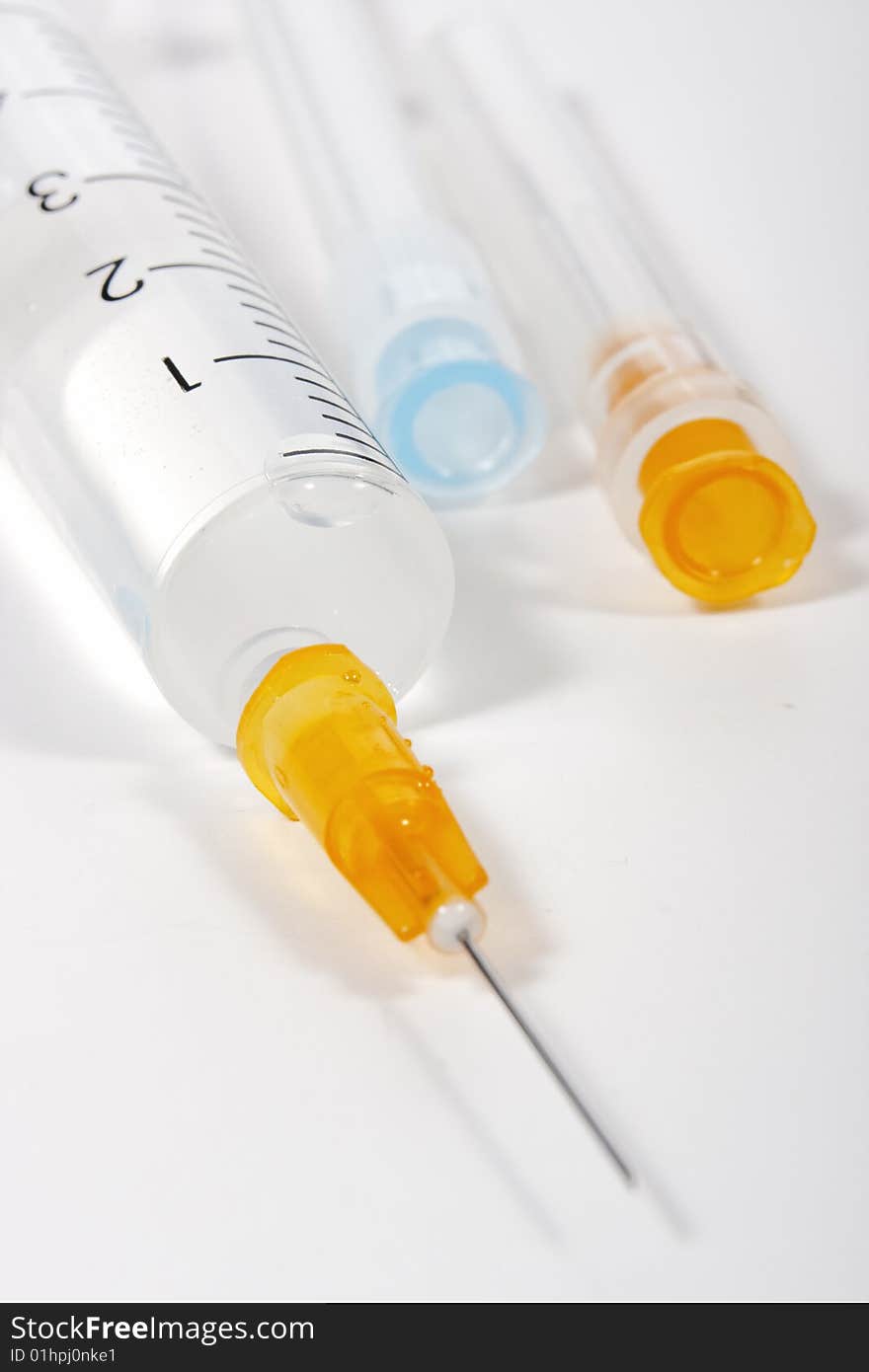 Syringe with hypodermic needle on white background. Syringe with hypodermic needle on white background