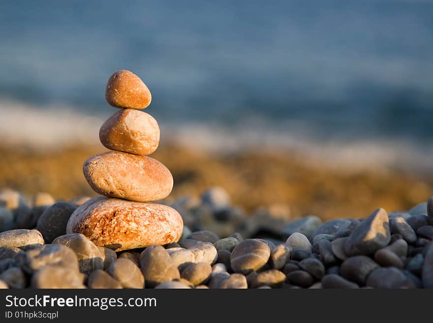 Balanced stones on sea