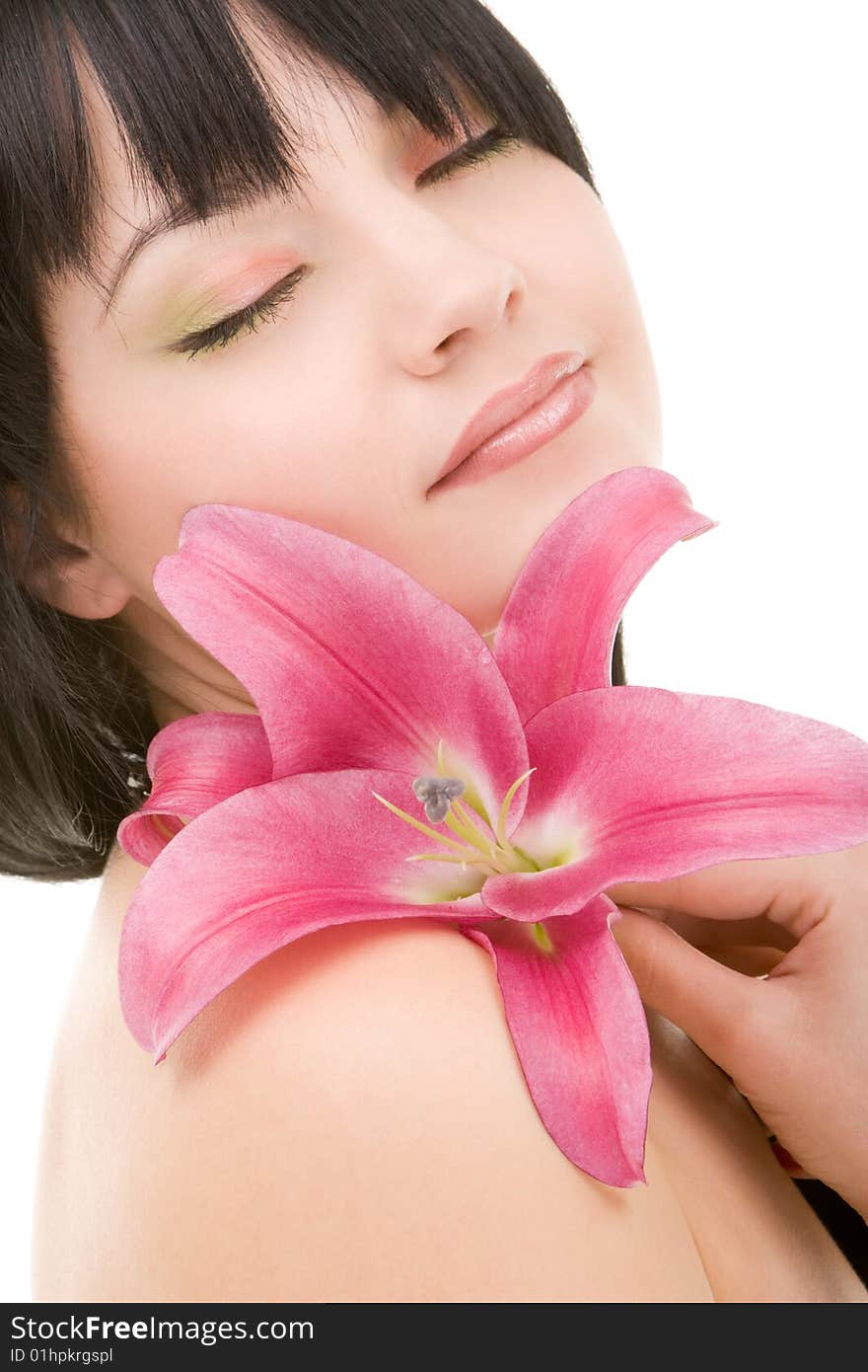 Young woman with lily flower on the white background