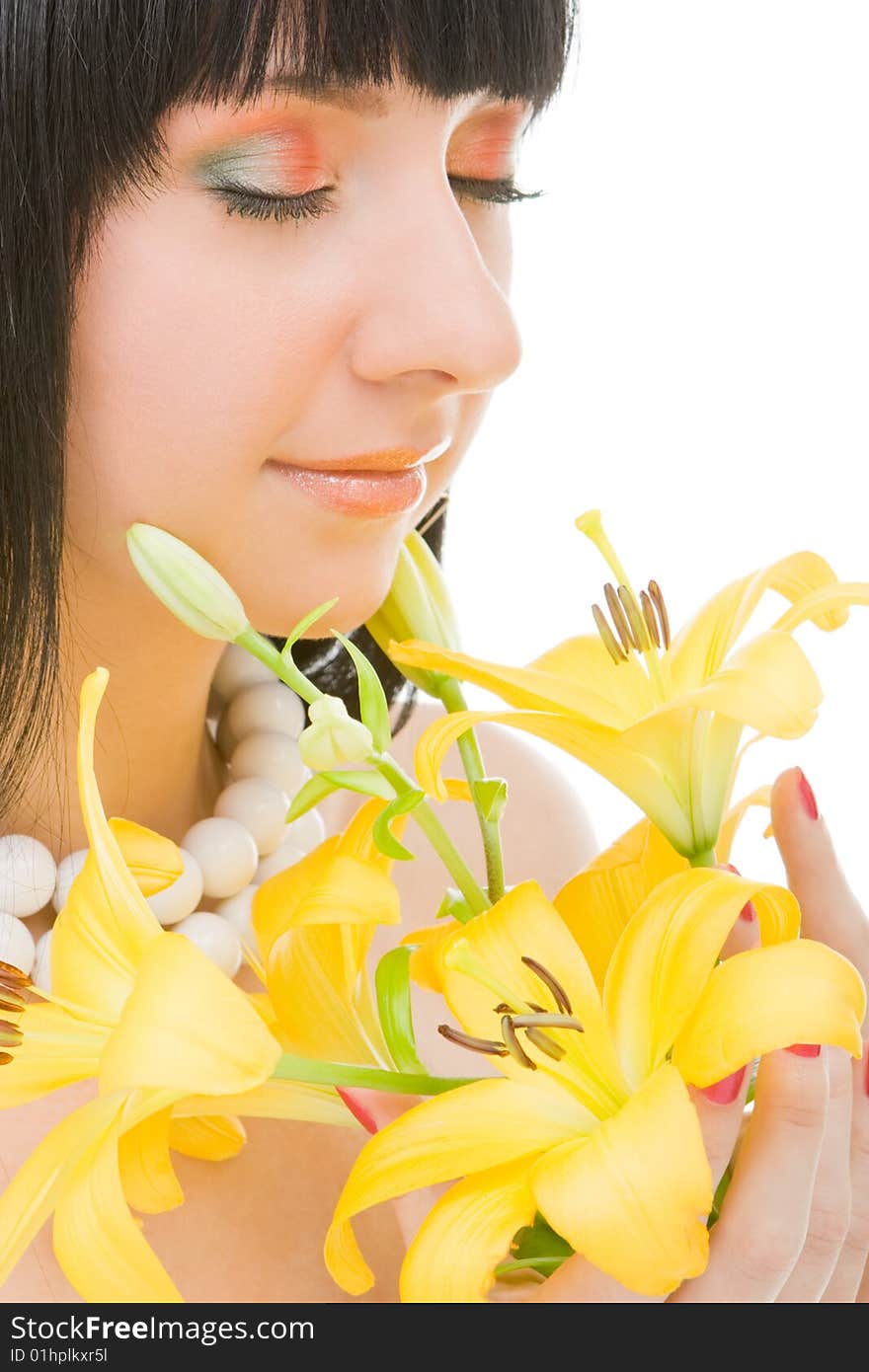 Young woman with lily flower on the white background