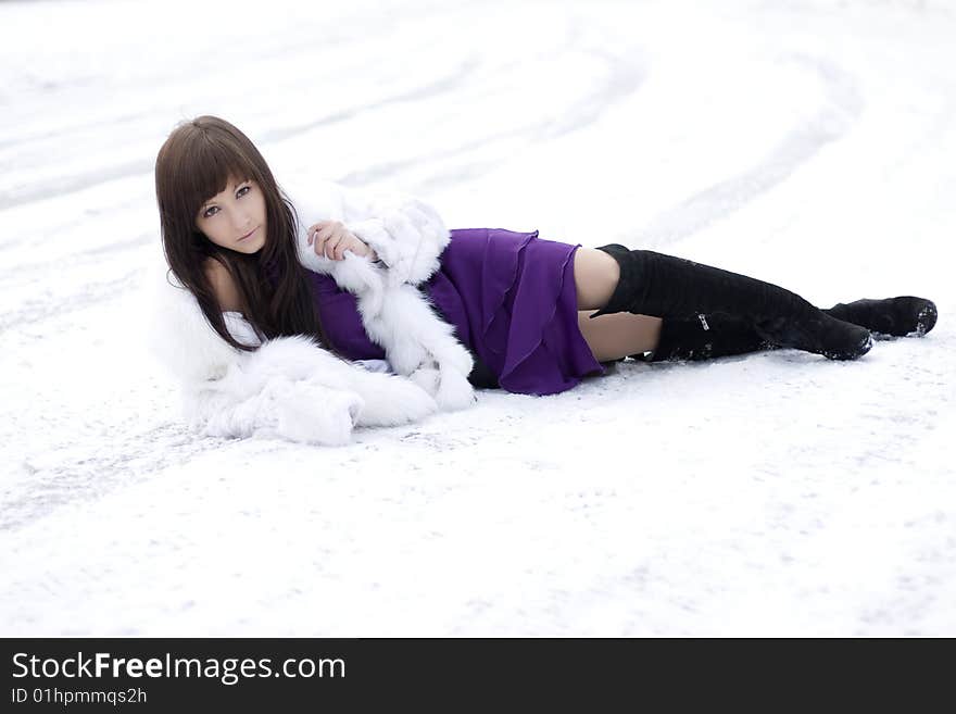 Girl Who Lies On The Snow In  Dress