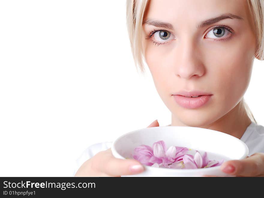 Beautiful blond woman with bowl of flowers. Beautiful blond woman with bowl of flowers