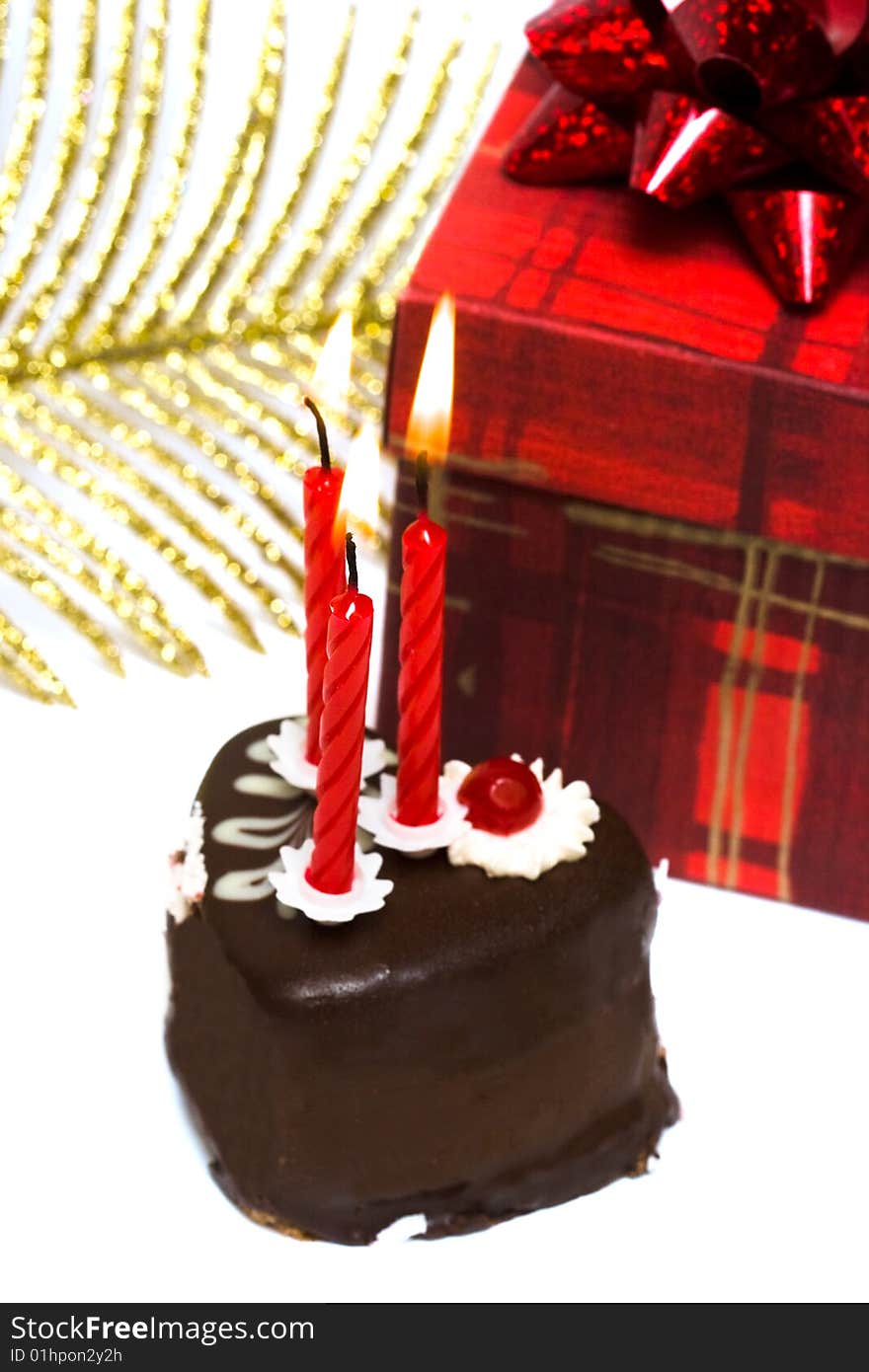 Cake with candles and gift box