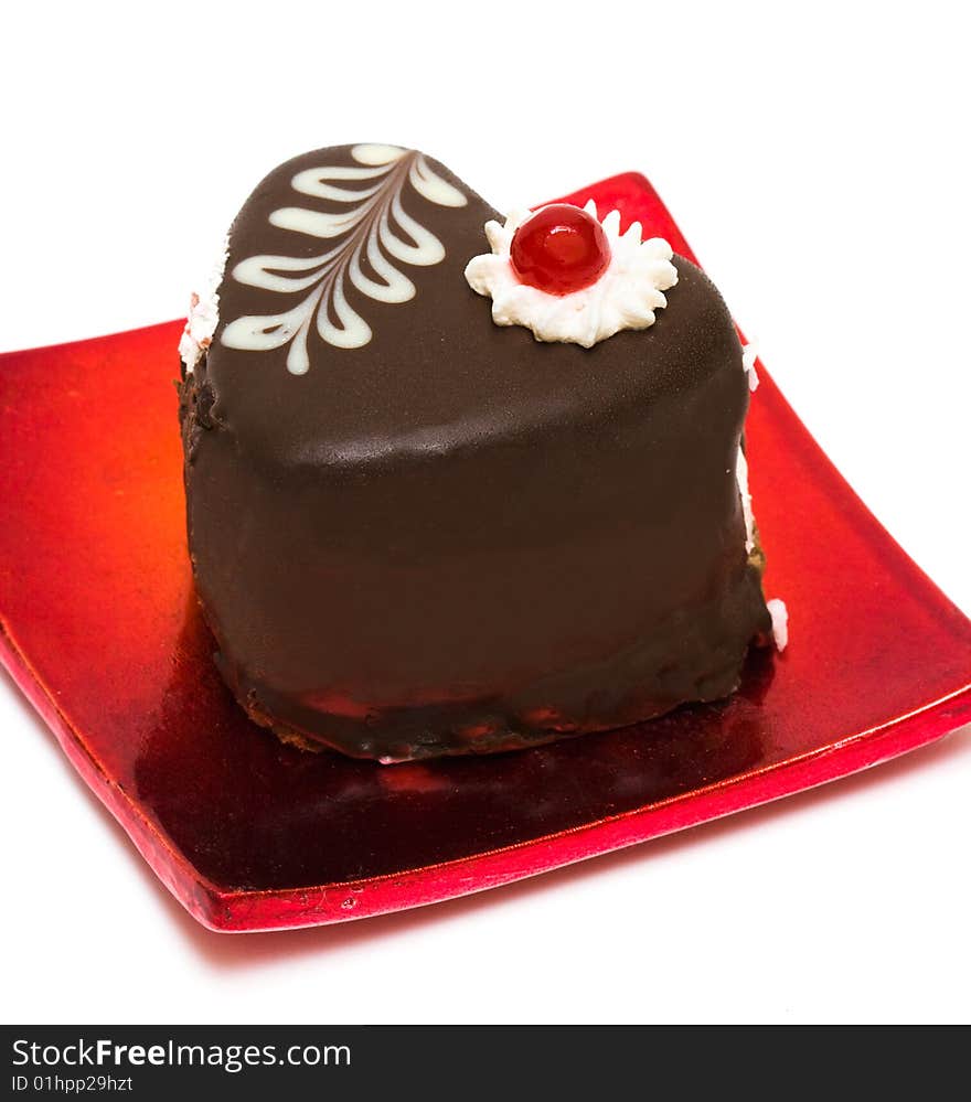 Chocolate cake on red plate