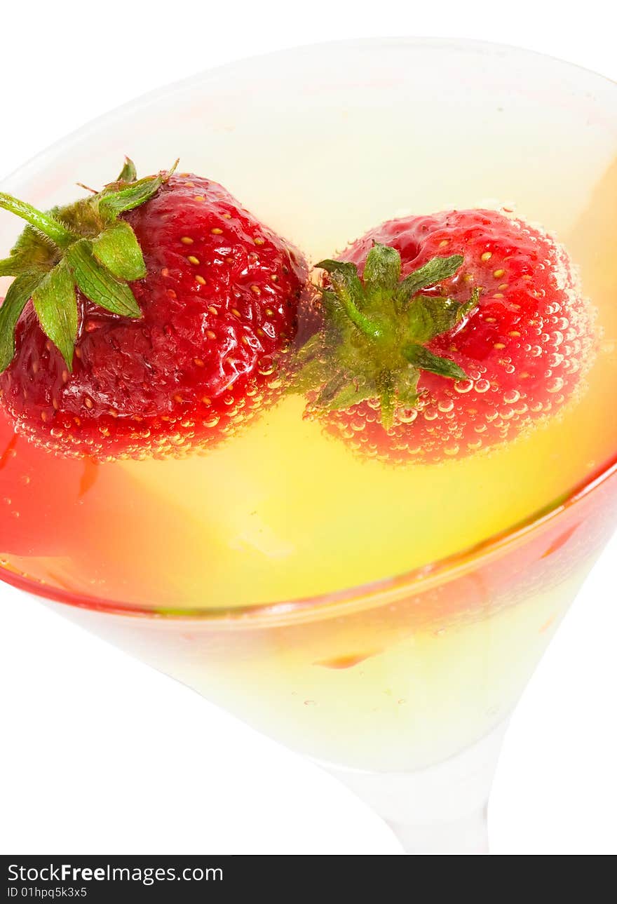 Strawberry with glass of cocktail isolated