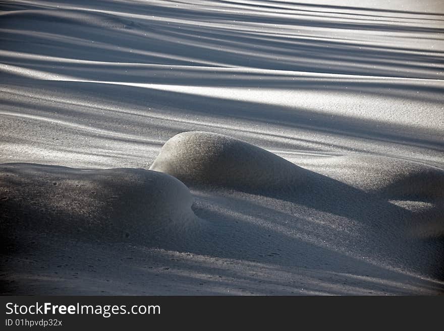 Snow covered field with sharp shadows. Snow covered field with sharp shadows.