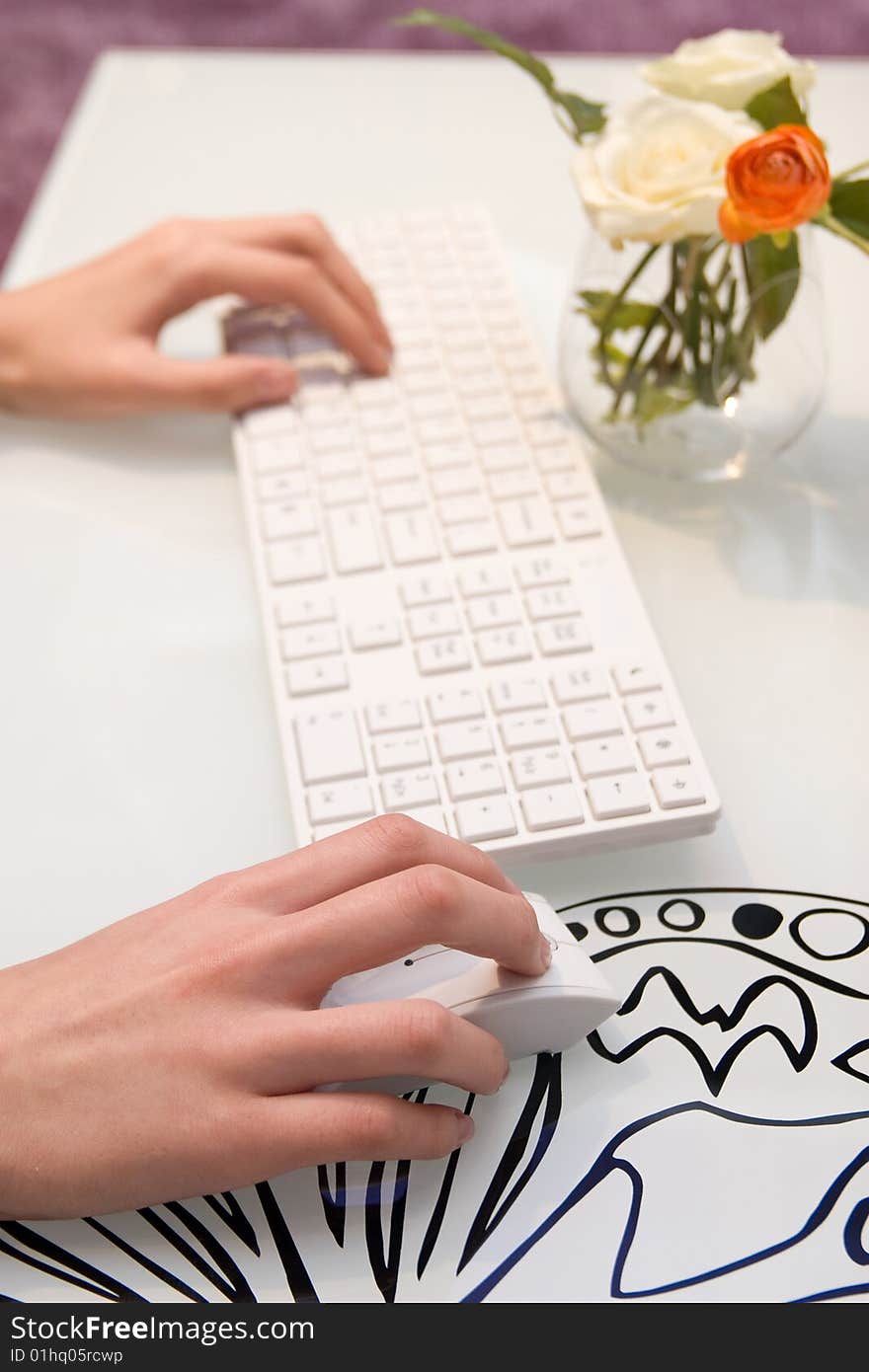 Businesswoman working on white keyboard