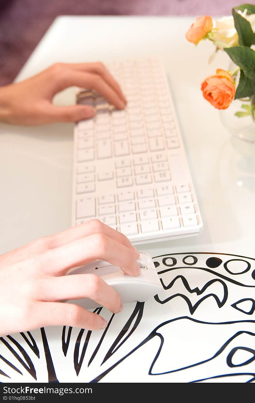 Businesswoman working on white keyboard