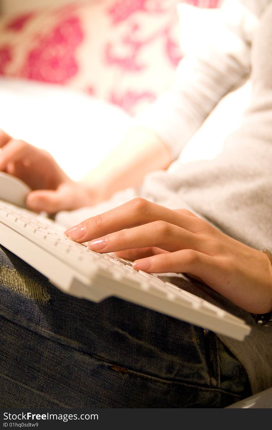 Businesswoman working on white keyboard