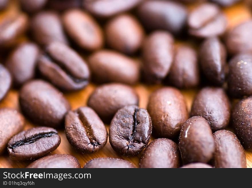 Coffee beans on the cutting board. close up