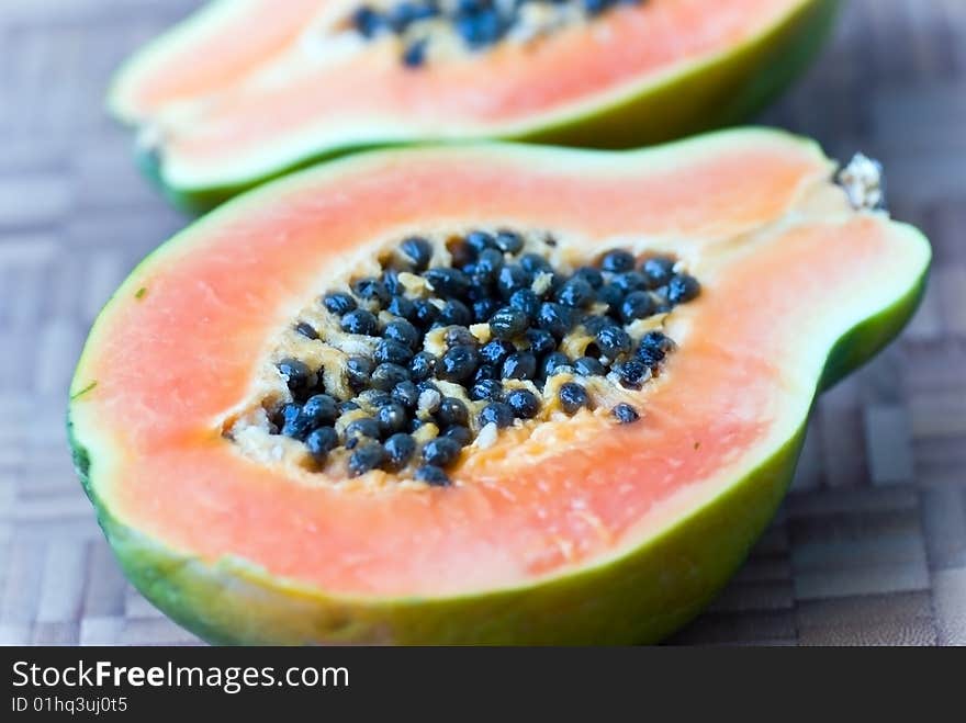 Papaya Half With Seeds On The Cutting Board