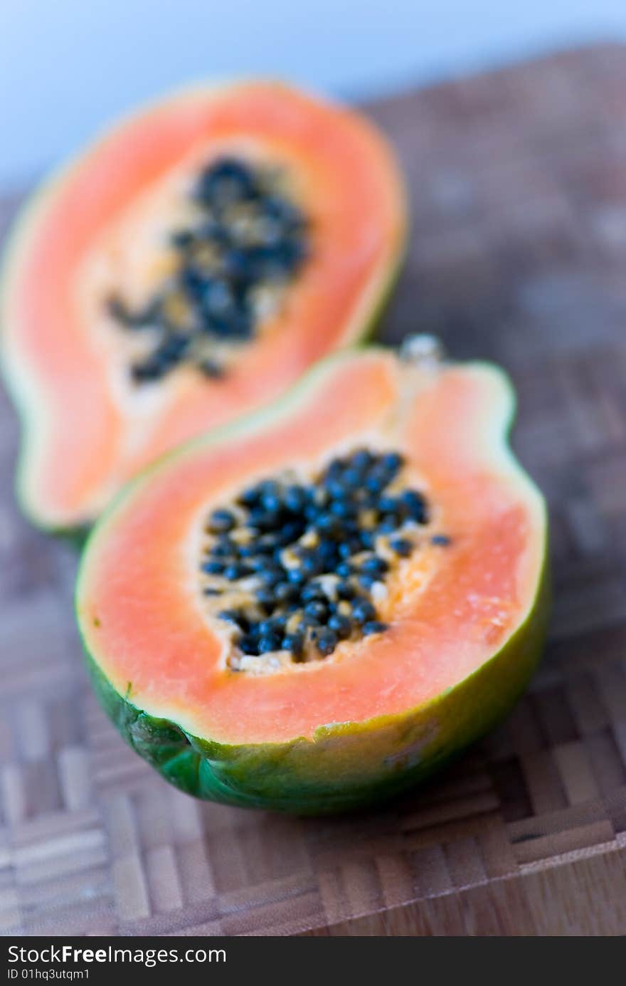 Papaya Half With Seeds On The Cutting Board