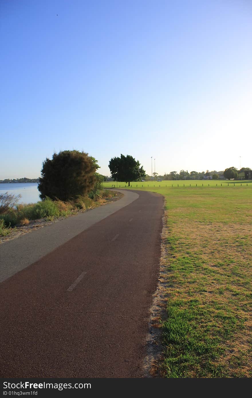 A jogging track near lake. A jogging track near lake