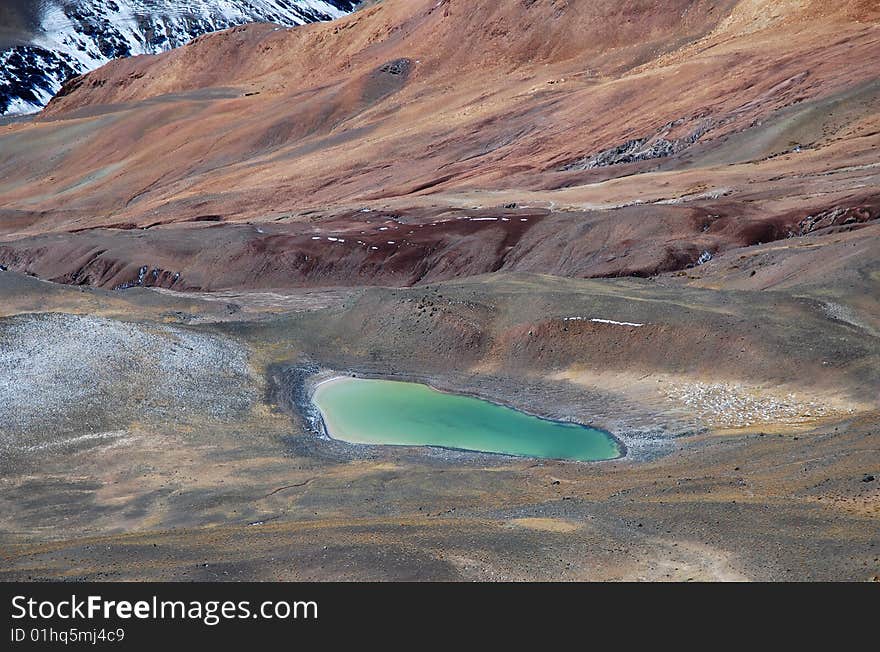 Turquoise Alpine Lake in Footprint Shape. Turquoise Alpine Lake in Footprint Shape