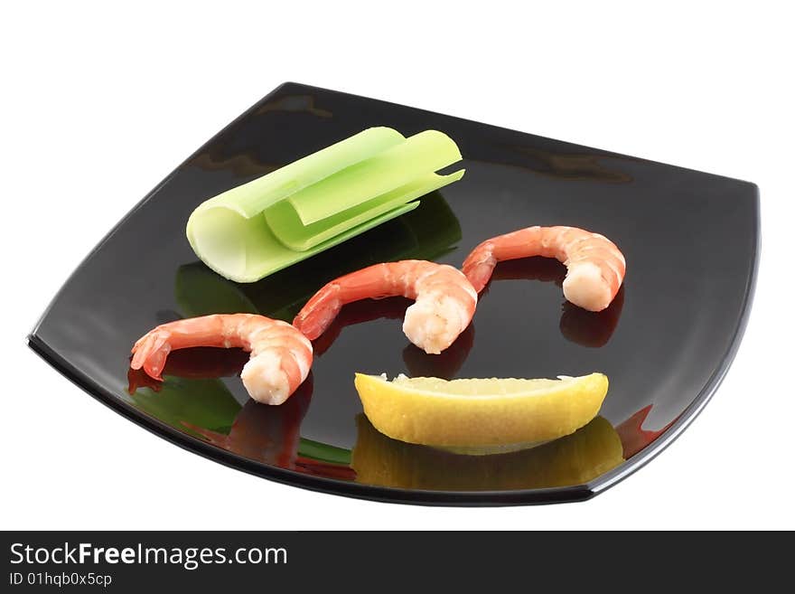 Three shrimps on black plate