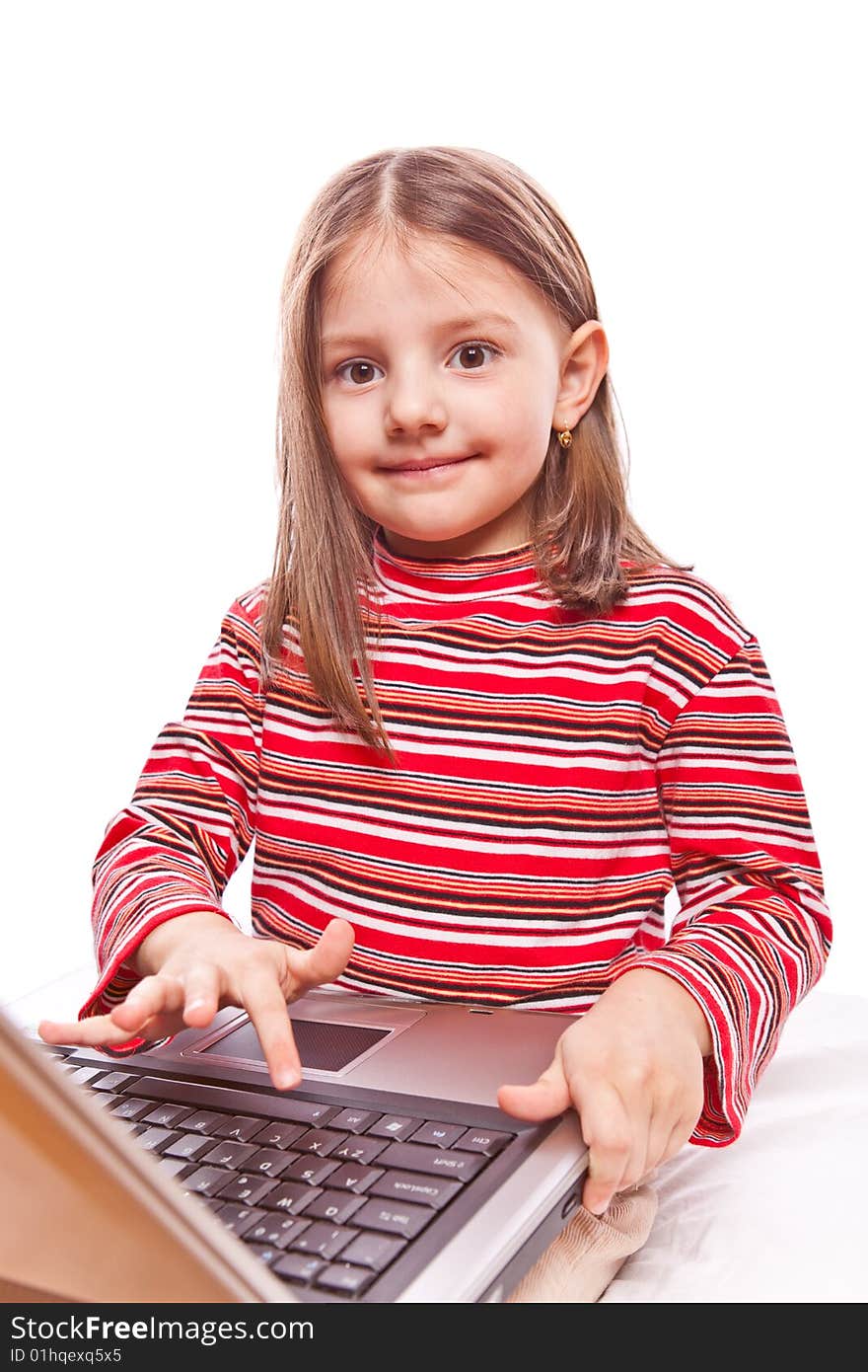 Studio photo of little girl with laptop