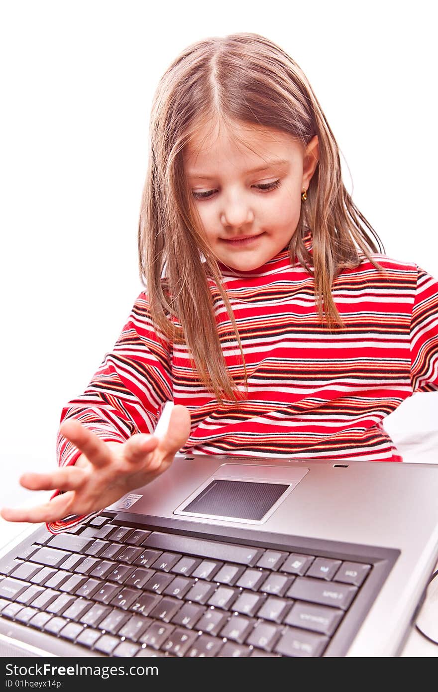 Studio photo of little girl with laptop