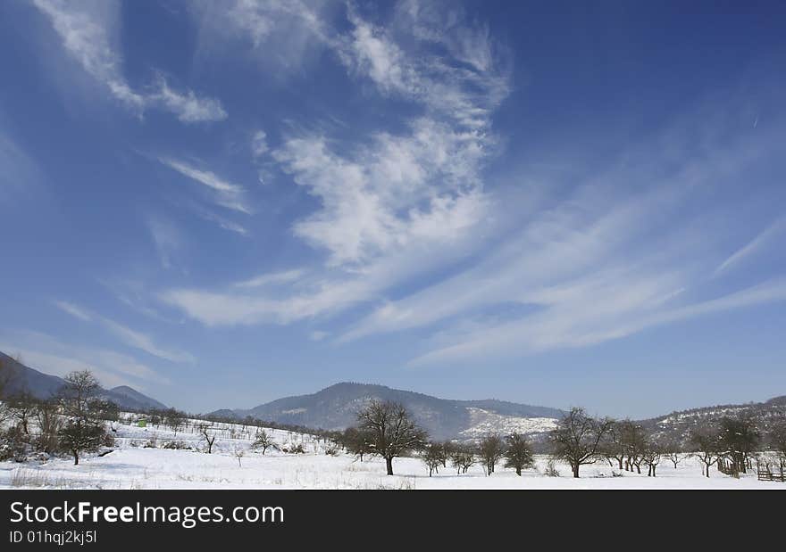 Winter landscape with beautiful clouds