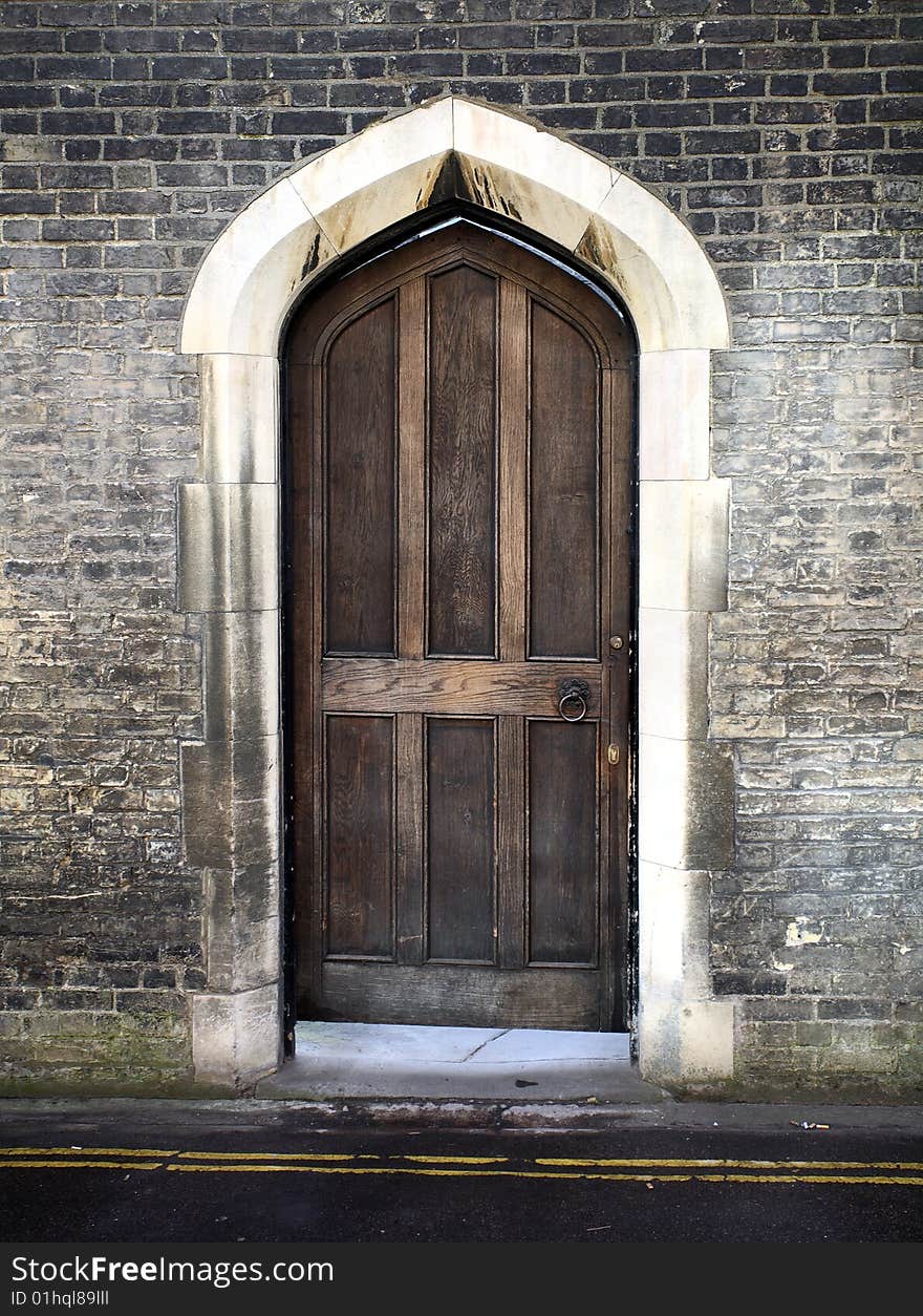 A gothic arched door from Cambridge in the united kingdom. A gothic arched door from Cambridge in the united kingdom