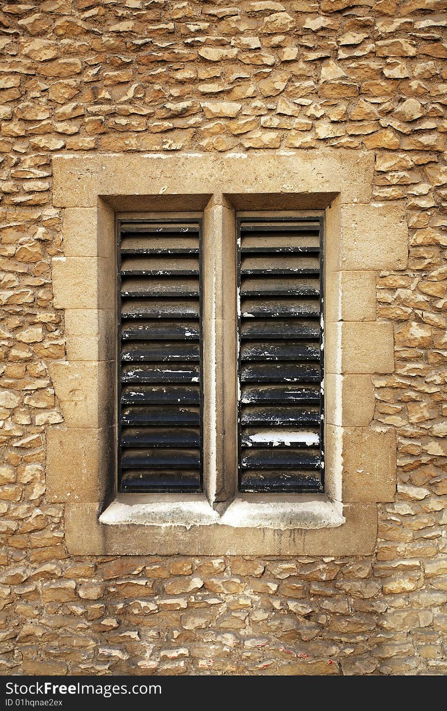 Slatted window in sandstone blocks