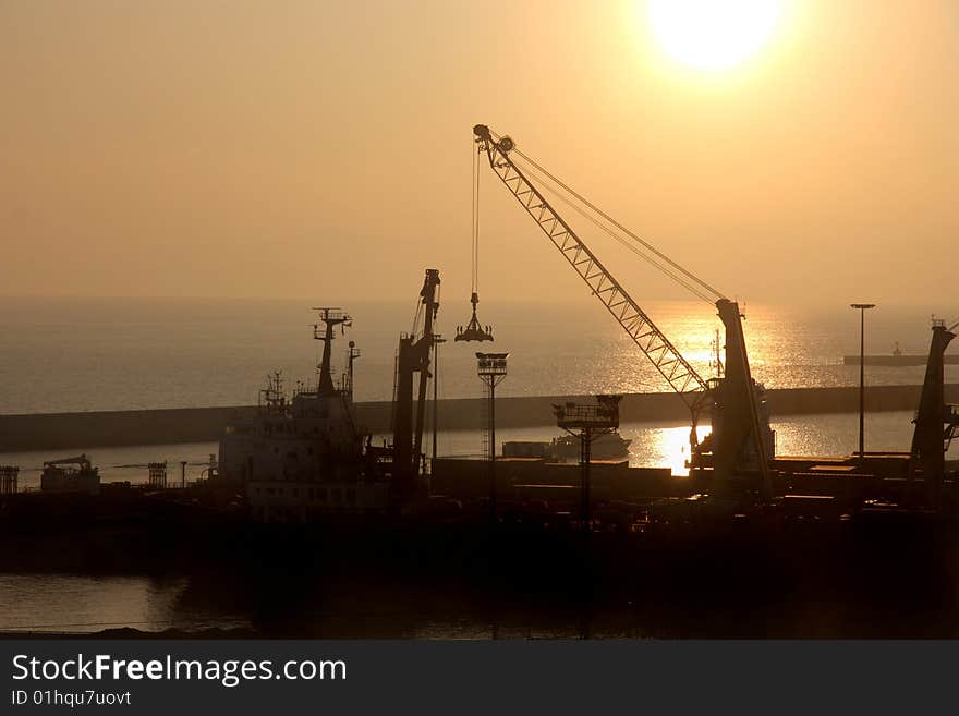 View of Genoa docks at the sunset