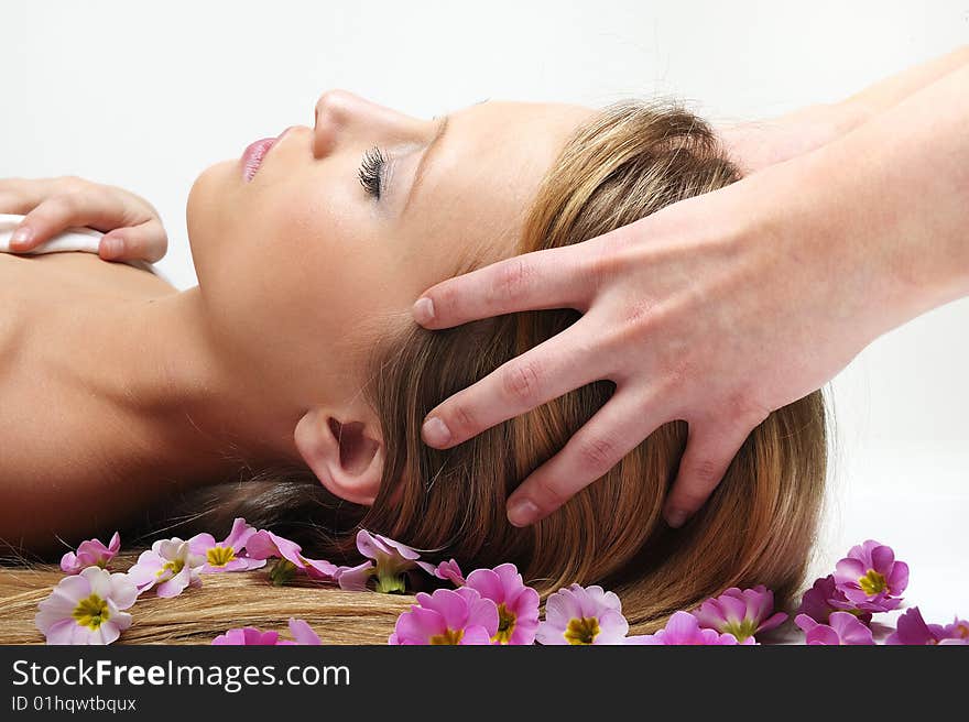 Beautiful girl having massage in spa