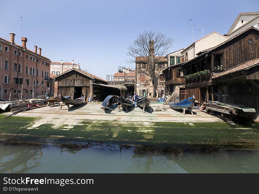 Canal in Venice in summer with blue sky