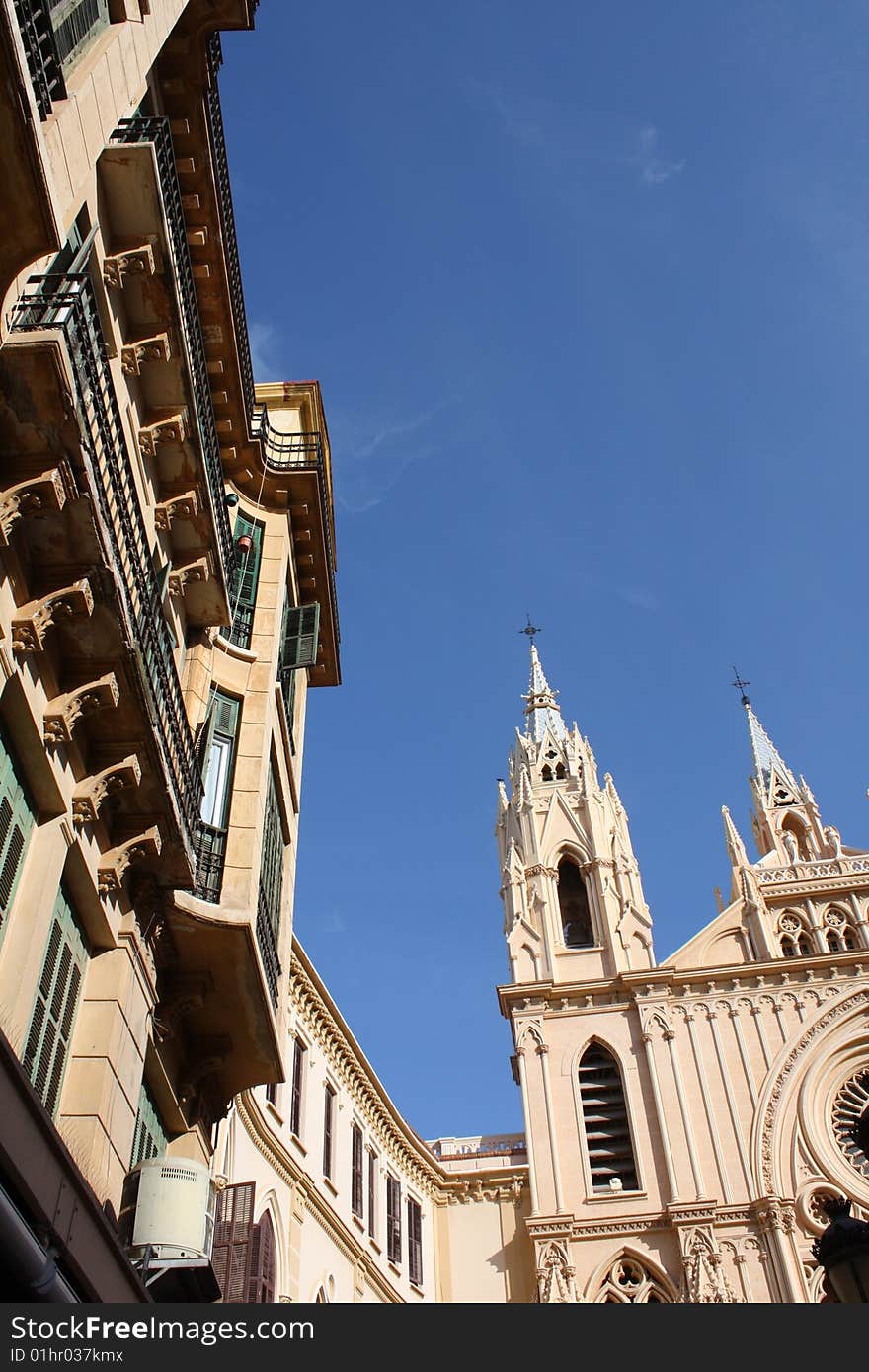 Facade of a church and surrounding buildings in the historic centre of Malaga on the southern coast of Spain. Facade of a church and surrounding buildings in the historic centre of Malaga on the southern coast of Spain.