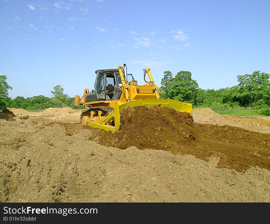 Bulldozer moving land