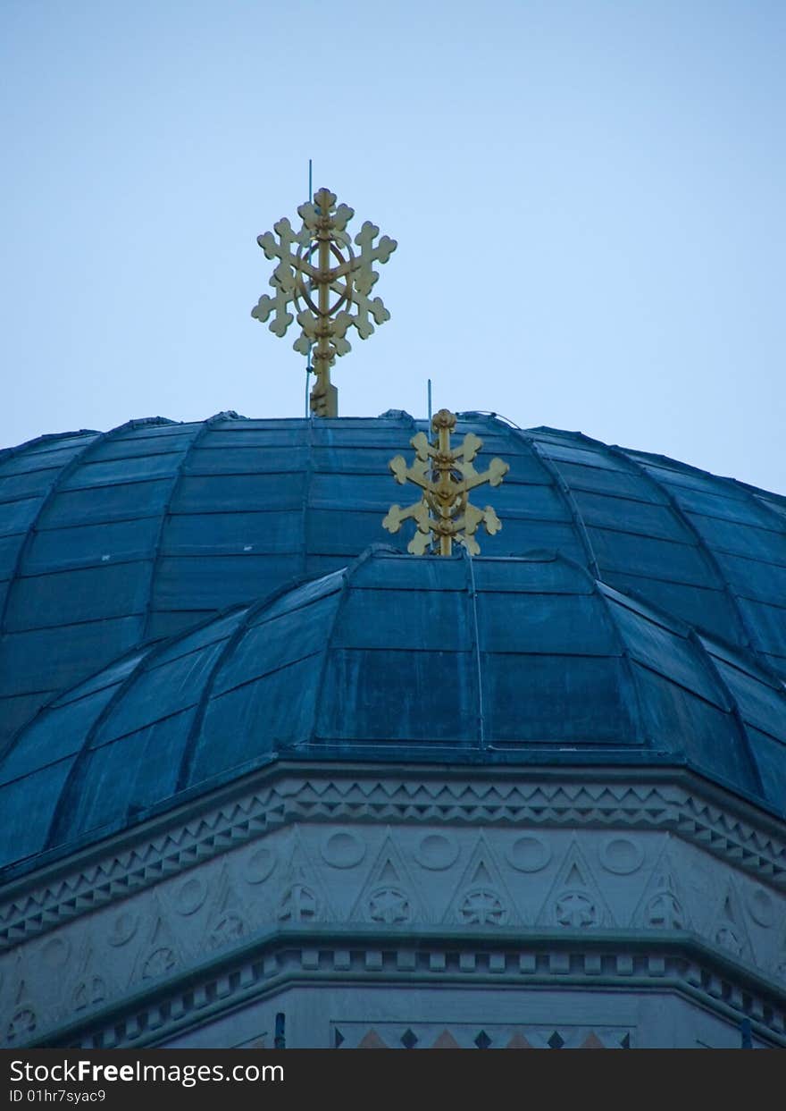 Orthodox church cupolas with golden crosses, against clear blue sky *RAW format available
