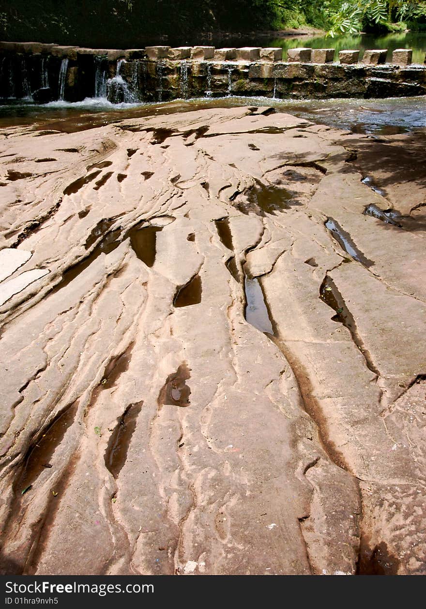 A picture of a stone bridge over a river. A picture of a stone bridge over a river