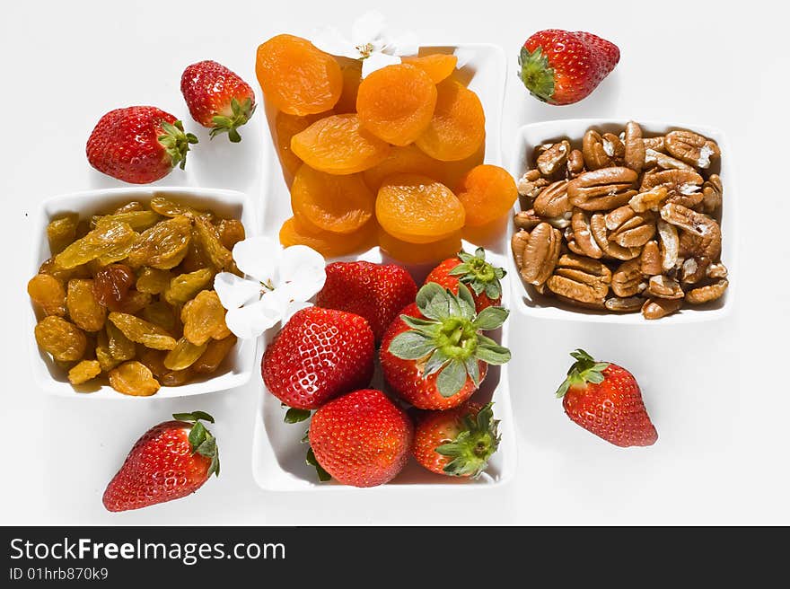 diet breakfast with dried apricots , ripe strawberry,raisins and nuts. diet breakfast with dried apricots , ripe strawberry,raisins and nuts