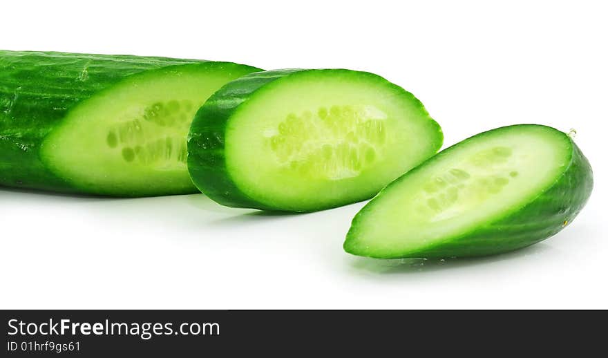 Slices of fresh green cucumber isolated on a white background