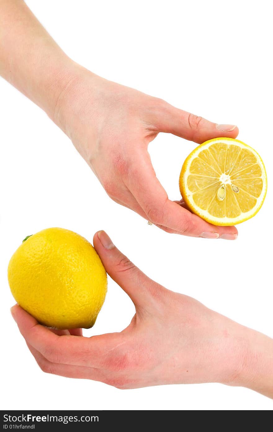 Woman's hands holding citrus fruits (lemon) isolated on a white background