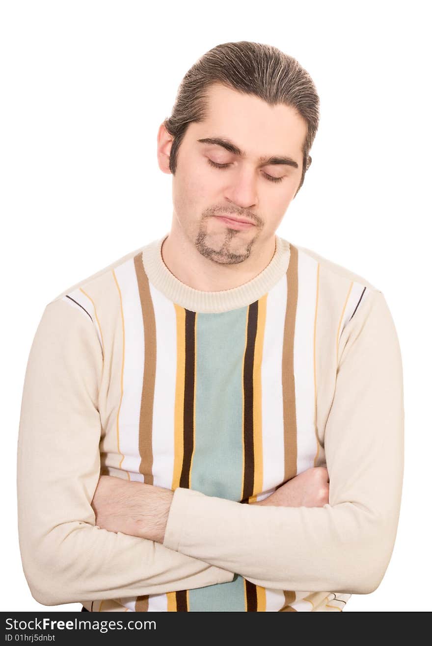 Young dark haired caucasian man in striped sweater looking down in dissappointment isolated on white. Young dark haired caucasian man in striped sweater looking down in dissappointment isolated on white