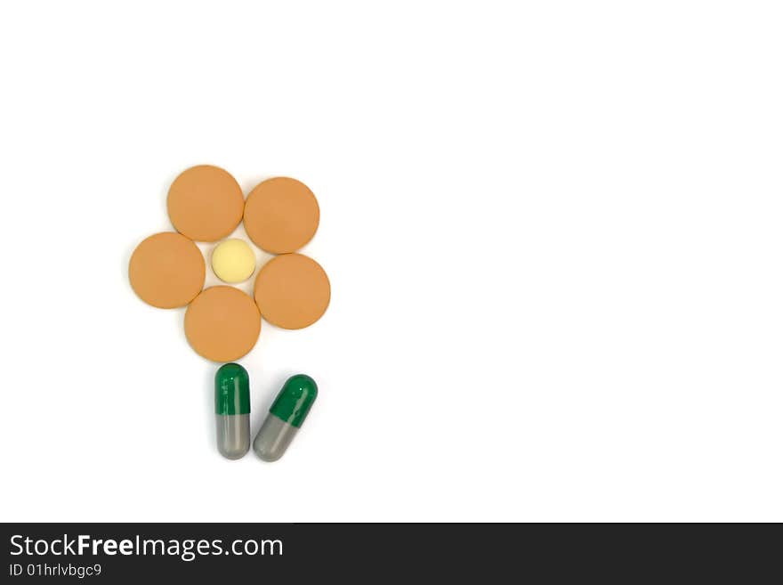 Symbolic flower made from tablets and capsules that helps to make positive impression from taking medicines. Symbolic flower made from tablets and capsules that helps to make positive impression from taking medicines