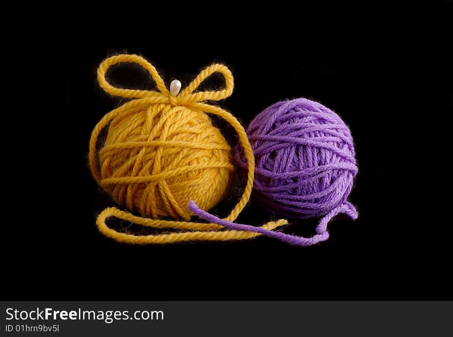 Two balls with yarn