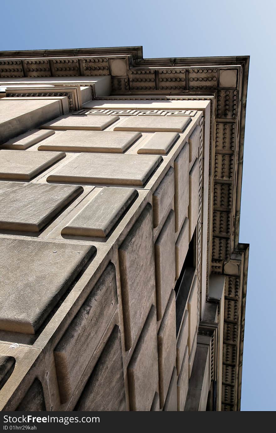 Textured Granite Block Building against blue sky