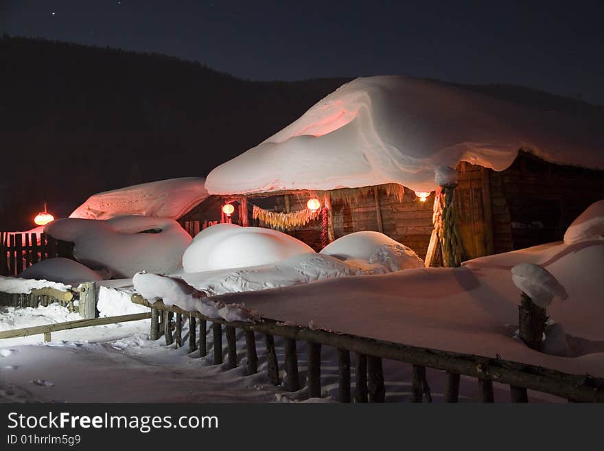 A house covered in snow  in winter