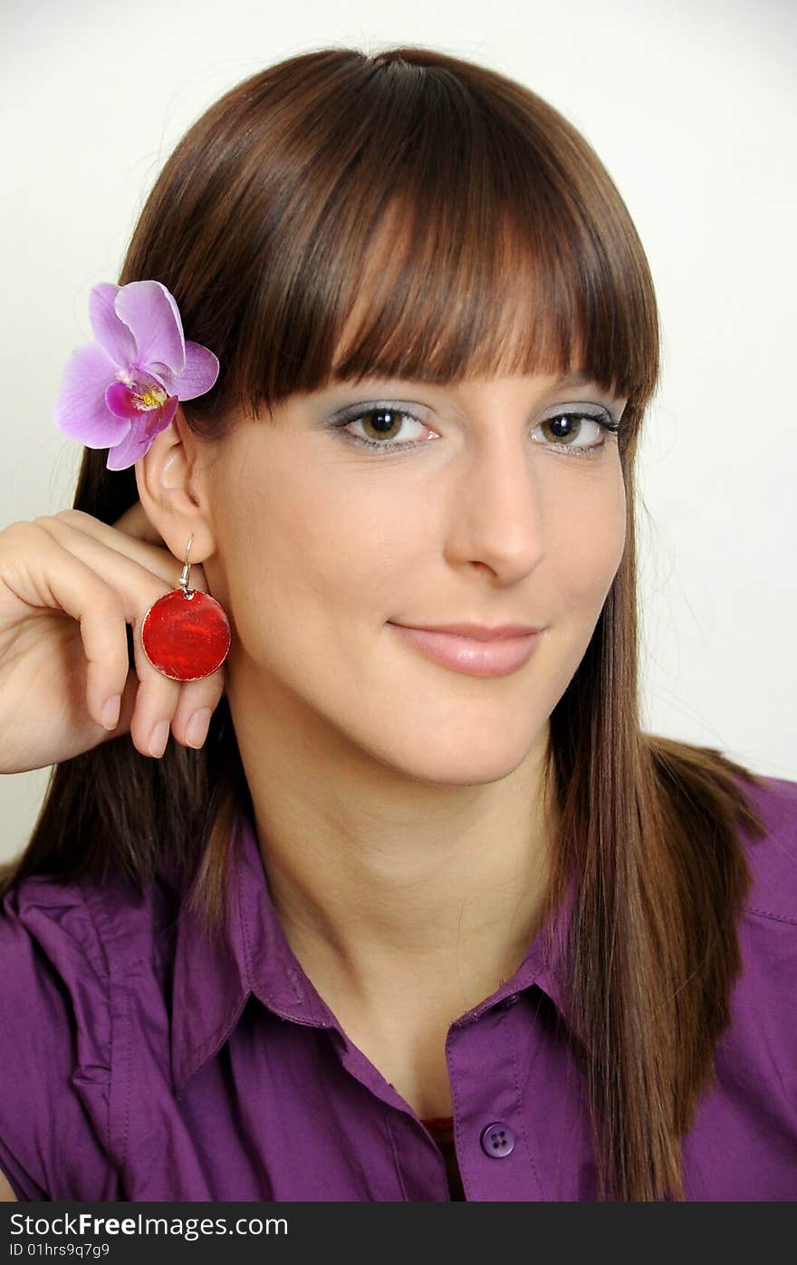 Portrait of a beautiful young girl with flower behind her ear. Portrait of a beautiful young girl with flower behind her ear