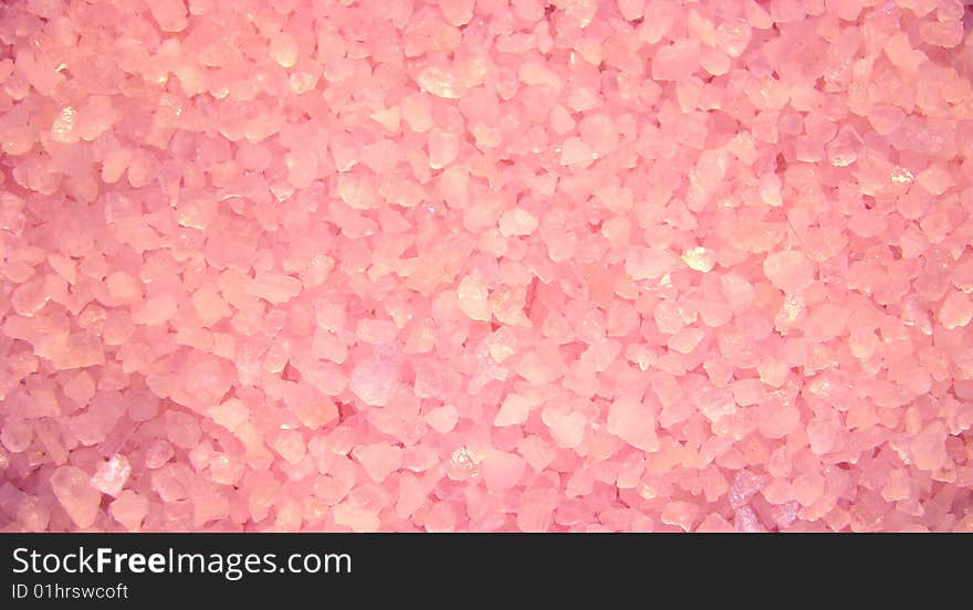 Pink granules of salt for acceptance of bath